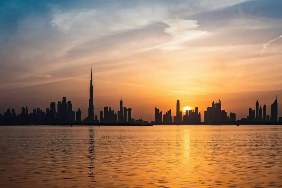 The Dubai skyline at dusk, seen across the water